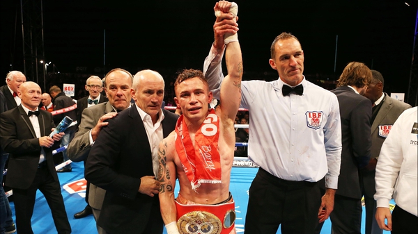 Carl Frampton celebrates winning his title with manager Barry McGuigan