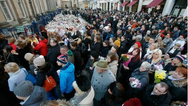 The vigil took place in Glasgow's Royal Exchange Square where bouquets of flowers and candles have been placed
