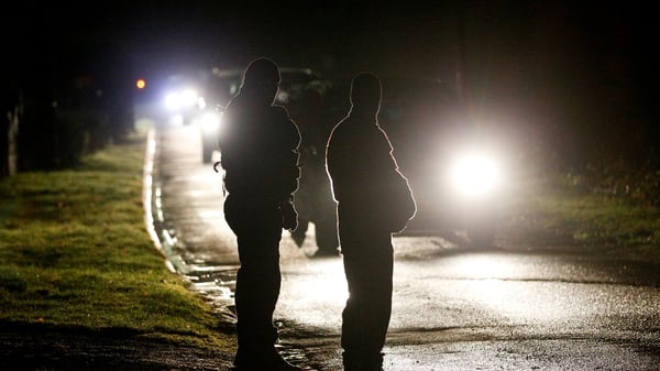 French police stand at a check point during the manhunt near Villers Cotterets, northeast of Paris