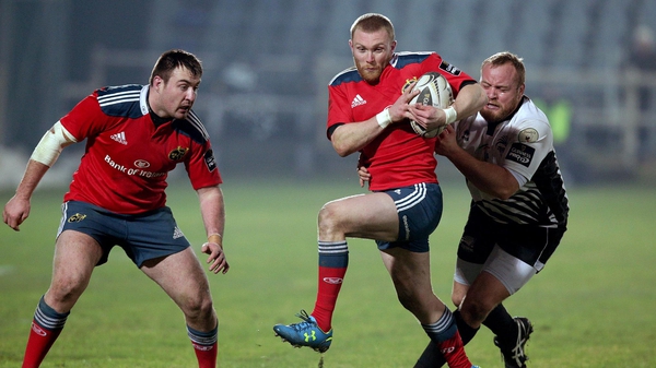 Munster's Keith Earls tackled by Dario Chistolini of Zebre