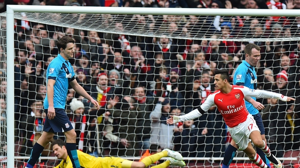Alexis Sanchez turns to celebrate scoring Arsenal's second goal