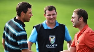Andy Sullivan of England and Charl Schwartzel of South Africa, seen here at the end of the third round, played out a play-off on Sunday