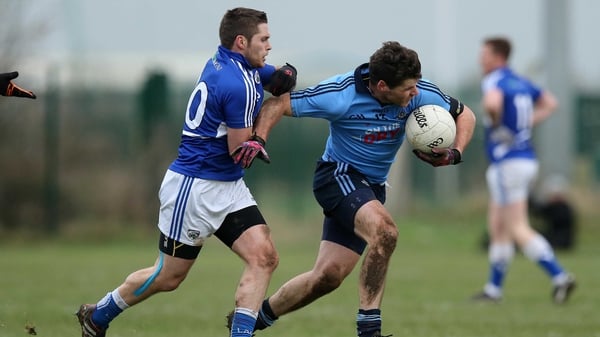 Dublin's Kevin McManamon tries to break free from the attention of Laois's Robbie Kehoe