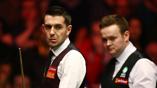 World champion Mark Selby (left) has been put out of the Masters by Shaun Murphy (right)