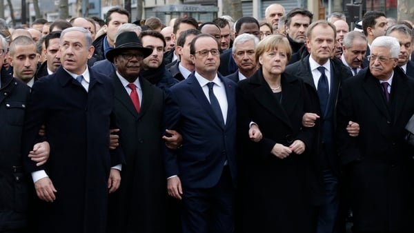 French President Francois Hollande links arms with other world leaders at the start of the Paris march