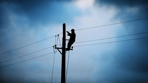 ESB worker Shane McGowan works on a telegraph pole in the area of Drumcliffe, Co Sligo