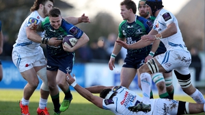 Connacht's Jack Carty looks to break the tackles of Don Armand and Ben Moon