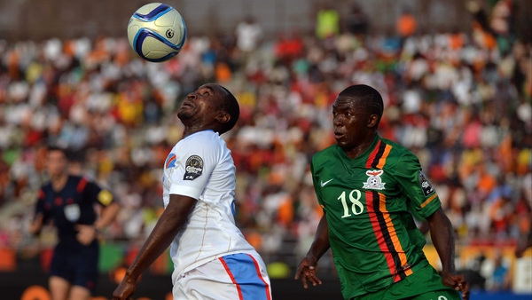 Firmin Ndombe Mubele of the Democratic Republic of Congo beats Zambia's Emmanuel Mbola to the ball in Ebebeyin
