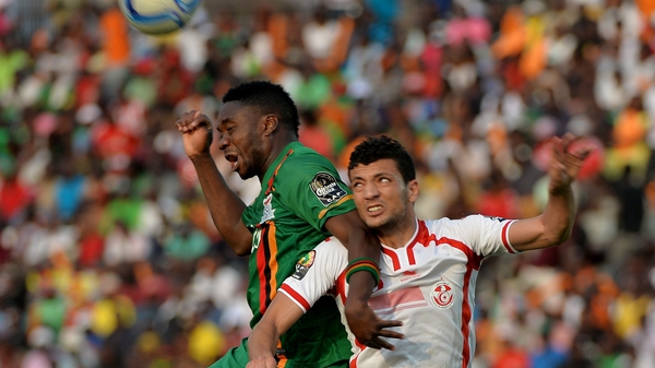 Zambia's Emmanuel Mayuka (l) vies with Tunisia's defender Rami Bedoui
