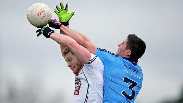 Tomas O'Connor of Kildare leaps for possession with Rory O'Carroll of Dublin