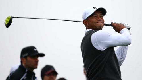 Tiger Woods grimaces after a drive from the tee at the Phoenix Open