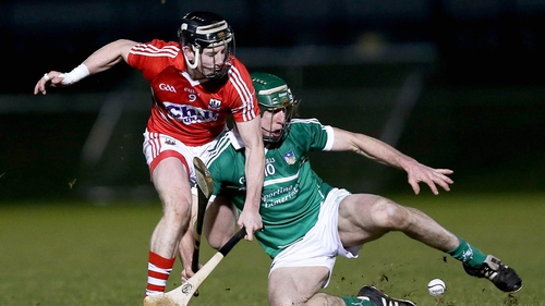 Andy Walsh of Cork and Limerick's Niall Moran battle for possession