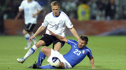 Sander Puri in Euro 2012 qualifying action for Estonia against Antonio Nocerino of Italy
