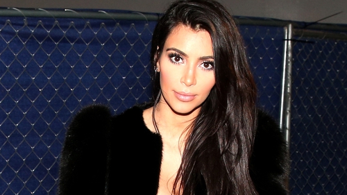 Kim Kardashian was held at gunpoint by five men posing as policemen