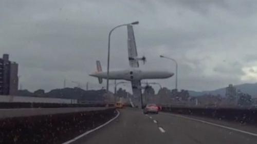 The plane veered between buildings, clipped an overpass, then crashed into a river