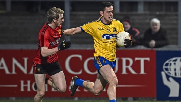 Down's Danny Savage chases down Roscommon's Ciaran Cafferkey