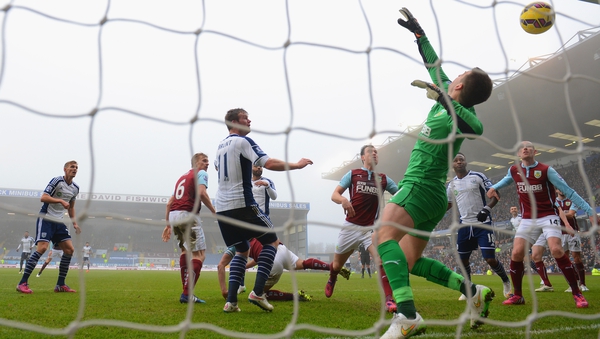 Chris Brunt of West Brom scores their first goal past Burnley 'keeper Thomas Heaton
