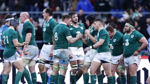 The Ireland players celebrate their win over Italy