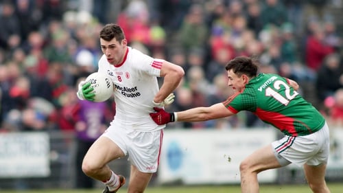 Paidi McNulty of Tyrone with Jason Doherty of Mayo in action during the game