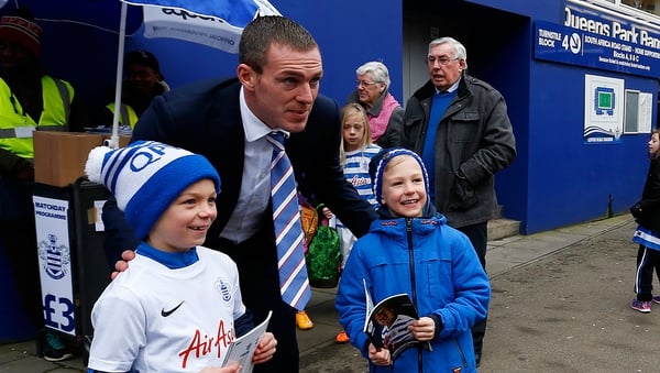 Richard Dunne poses for a photo with young fans before Saturday's game