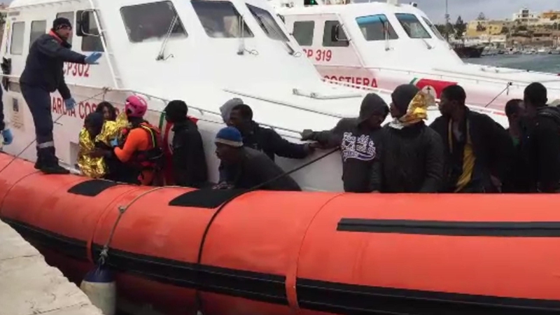 Migrants On Rescue Boat Disembark At Italian Port