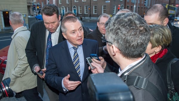 IAG chief Willie Walsh talks to reporters on his way out of Leinster House