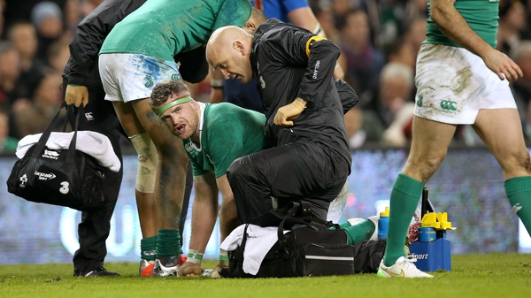 Ireland's Jamie Heaslip receives treatment following the incident with Pascal Papé of France