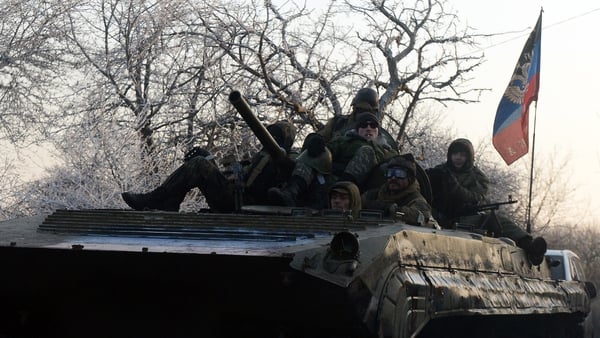 Pro-Russian separatists on an armoured personnel carrier near the eastern Ukrainian town of Uglegorsk