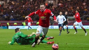 Wayne Rooney is fouled by the Preston goalkeeper to earn United a penalty that the England captain converted