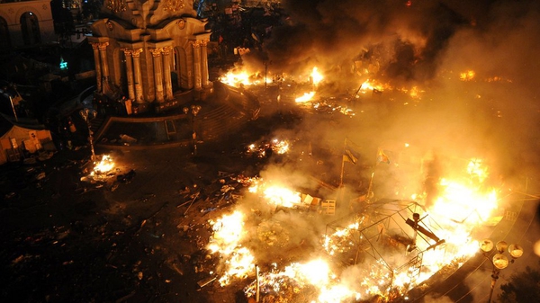 A day and night of bloody clashes saw flames engulf Maidan square, which resembled a war zone