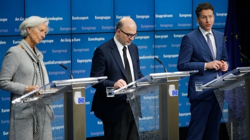 Christine Lagarde, Pierre Moscovici, and Jeroen Dijsselbloem give a press briefing on the deal