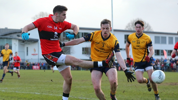 UCC's Paul Geaney attempts a shot on goal while under pressure from Conor Boyle of DCU