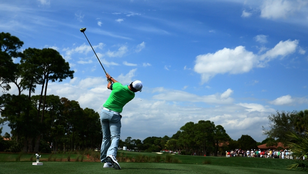 Rory McIlroy plays his shot from the second tee