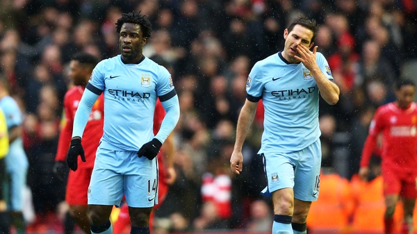 A dejected Wilfred Bony and Frank Lampard leave the pitch after the loss at Anfield