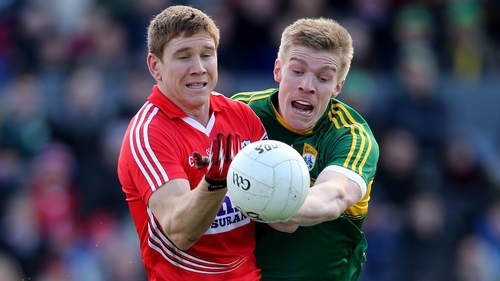 Cork's Stephen O'Donoghue (L) is tackled by Tommy Walsh of Kerry