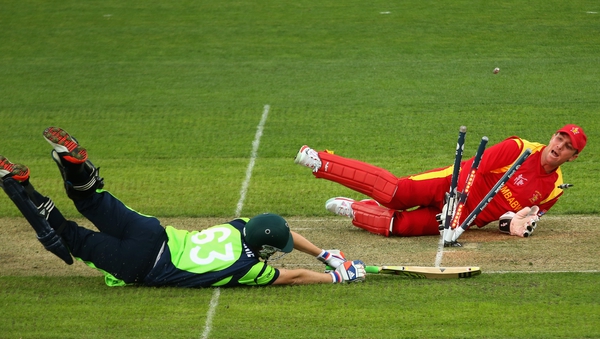 Ireland's Andrew Balbirnie is run out by Brendan Taylor of Zimbabwe during the ICC Cricket World Cup match