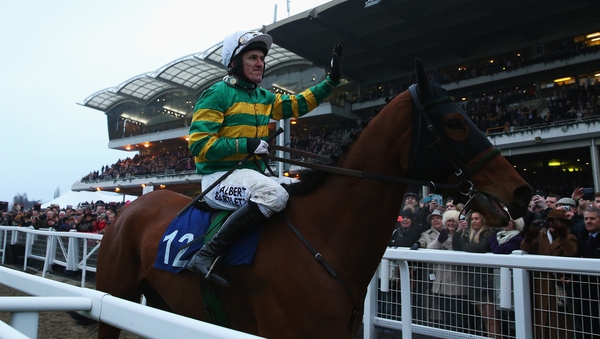Tony McCoy on Ned Buntline waves to the crowd after his final race at the Cheltenham Festival