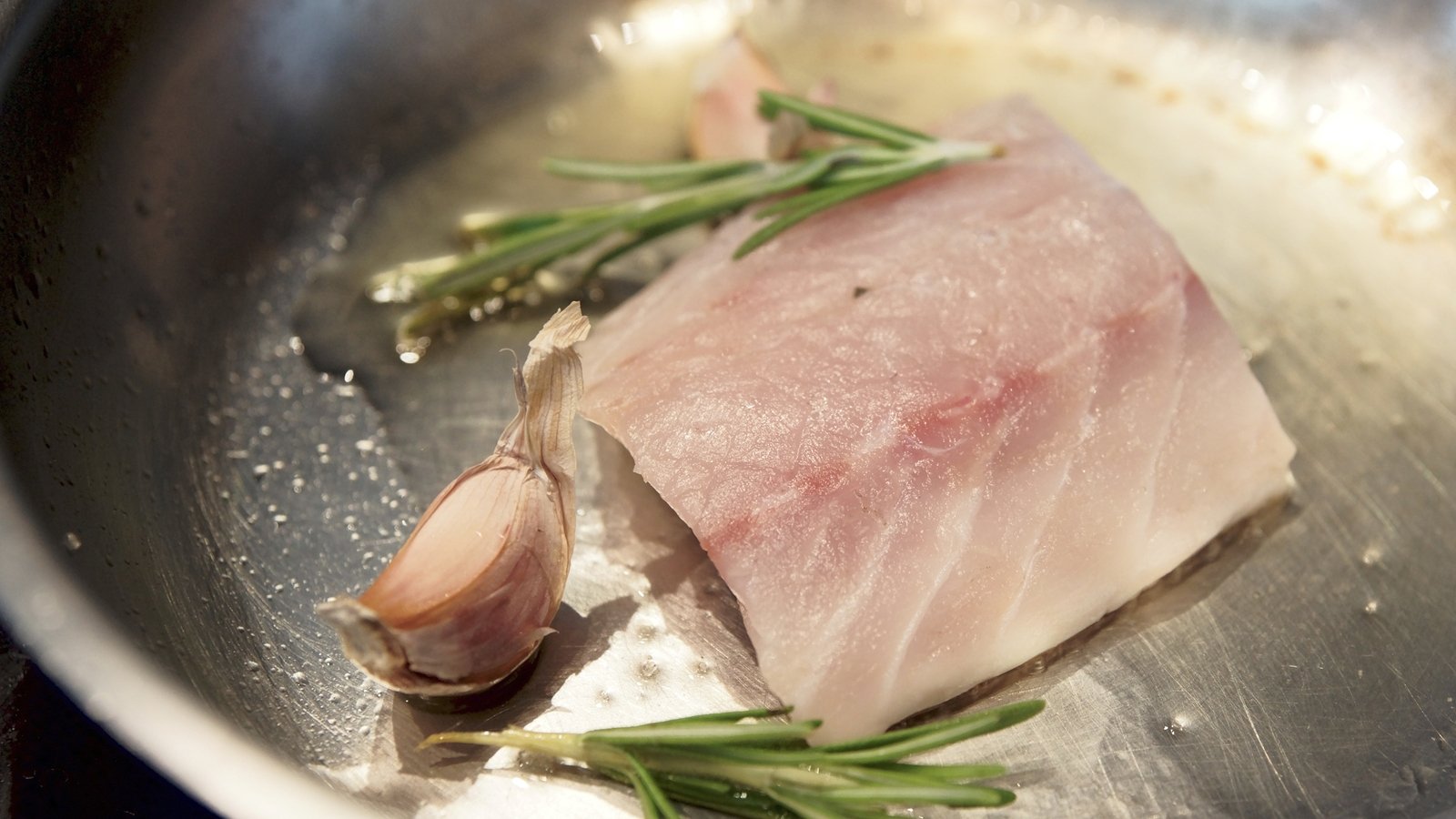 Pan Fried Sea Bass, Tomato and Olive Sauce Vierge, Buttered Spinach