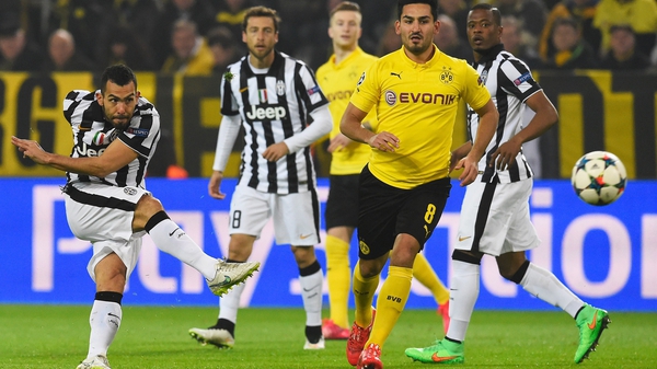 Carlos Tevez fires Juventus into a first-half lead at Dortmund