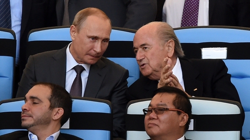 Russian President Vladimir Putin (L) and FIFA President Sepp Blatter attend the 2014 FIFA World Cup final