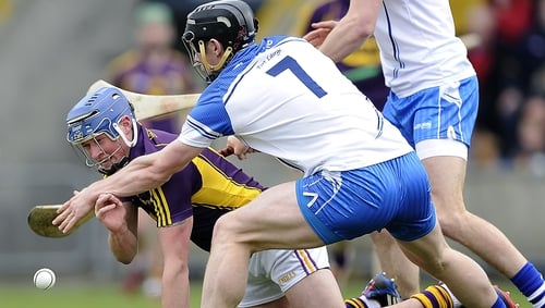 Wexford's Ian Byrne with Philip Mahony of Waterford