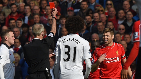Steven Gerrard is shown a red card by referee Martin Atkinson in the first minute of the second half