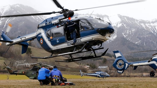A French police helicopter takes off near the scene of the crash