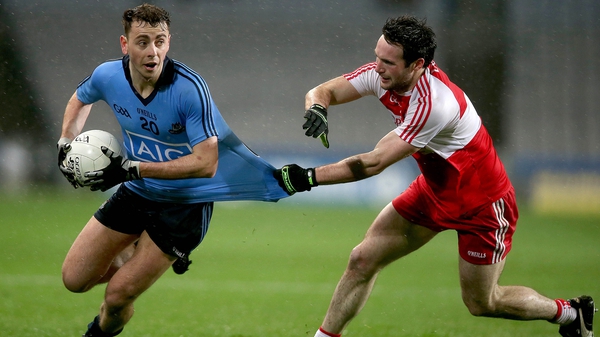 Cormac Costello of Dublin with Oisin Duffy of Derry