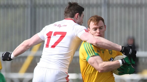 Donegal's Eamonn Doherty is blocked by Tyrone's Conor Clarke