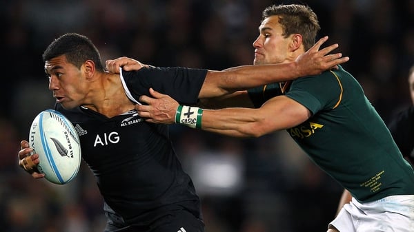 Charles Piutau fends against JJ Engelbrecht of South Africa during The Rugby Championship