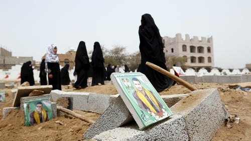 Women visit the graves of Houthi supporters in Sana'a - over 500 people have been killed in Yemen in recent weeks