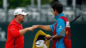 JB Holmes congratulates his caddie after winning the Shell Houston Open