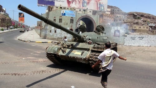 A tank being driven by militiamen loyal to President Hadi during clashes with Houthi fighters in Aden