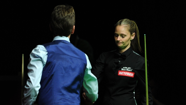 Ken Doherty commiserates with Reanne Evans after their match